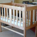 Child’s cot in ash